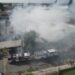 911 coordina asistencia de 21 unidades de bomberos para sofocar incendio afecta fábrica de tabaco en Moca